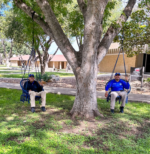 Academy cadets enjoy the swings on campus